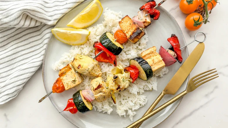 Grilled Mediterranean Tofu Skewers with Green Olive Relish on rice