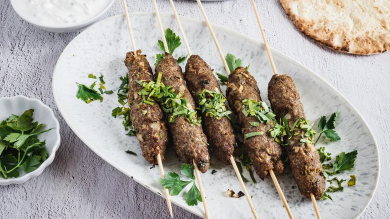 Lamb Kofta Kebabs on white plate with garnish