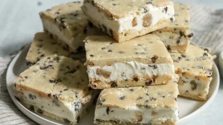 Cookie dough ice cream sandwiches stacked on top of one another
