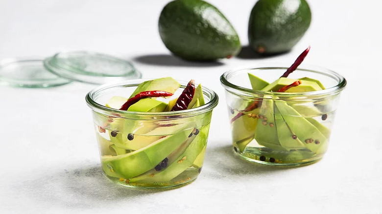 Pickled Avocado in two small glass jars