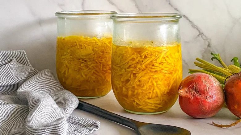 Sauerkraut-ish Pickled Beets in two glass jars on countertop
