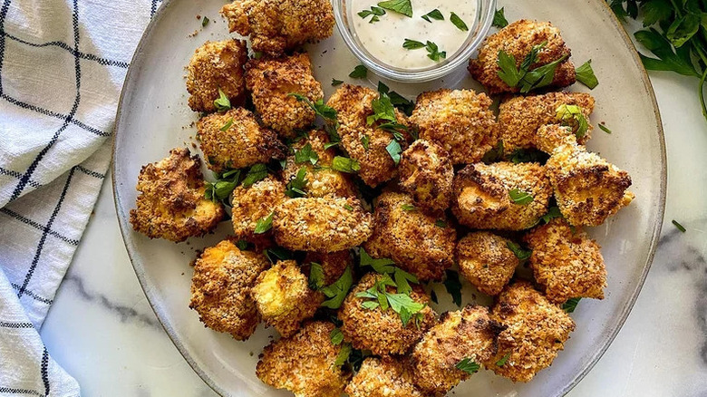 Air Fryer Tofu Nuggets on white plate with dipping sauce