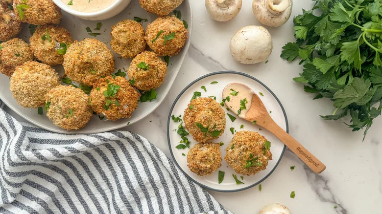 Crispy Air Fryer Mushrooms with Spicy Aioli on white plates
