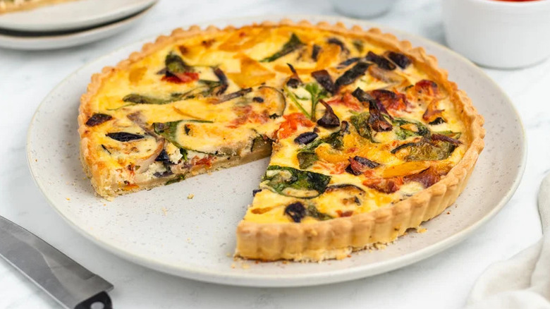 Roasted Vegetable Quiche on white plate