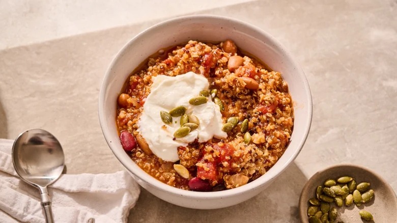 Bowl of turkey chili with pumpkin seeds