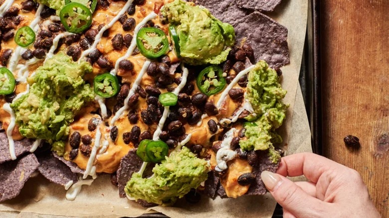 Close-up of pumpkin queso and black bean nachos
