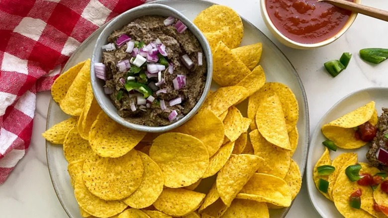 Black bean dip with tortilla chips on plate