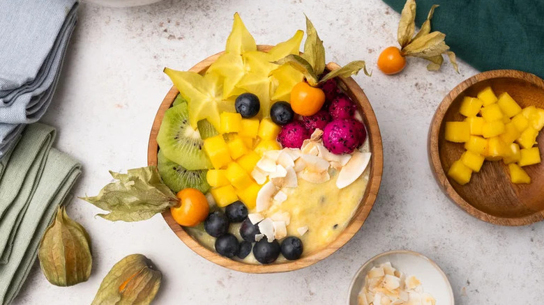 Vibrant Tropical Smoothie Bowl in wooden bowl