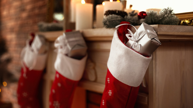 Christmas stockings hanging on fireplace