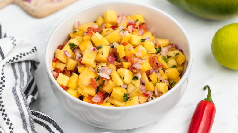 Mango salsa in white bowl