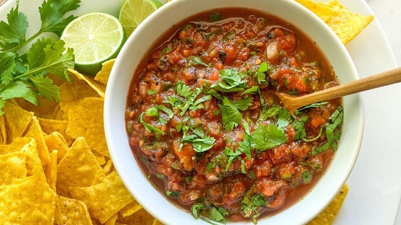 Bowl of fire-roasted tomato salsa topped with fresh cilantro