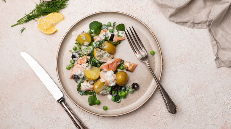 Grilled salmon, watercress, and pea salad on plate