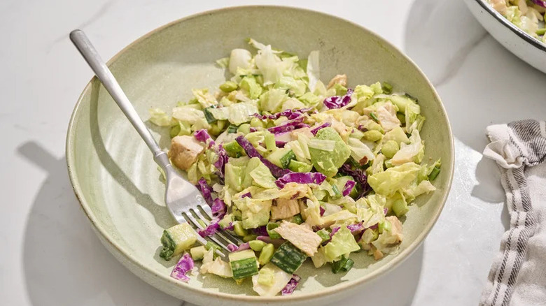 Edamame Salad with Peanut Dressing in wide white bowl