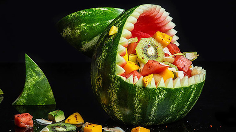 Watermelon fruit salad served inside a hand-carved watermelon shark's head