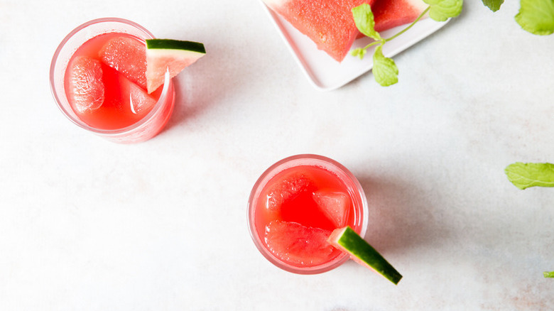 Watermelon cocktails in glasses, garnished with watermelon wedges