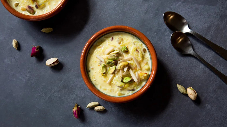 Creamy Kheer (Indian Rice Pudding) in small orange dish