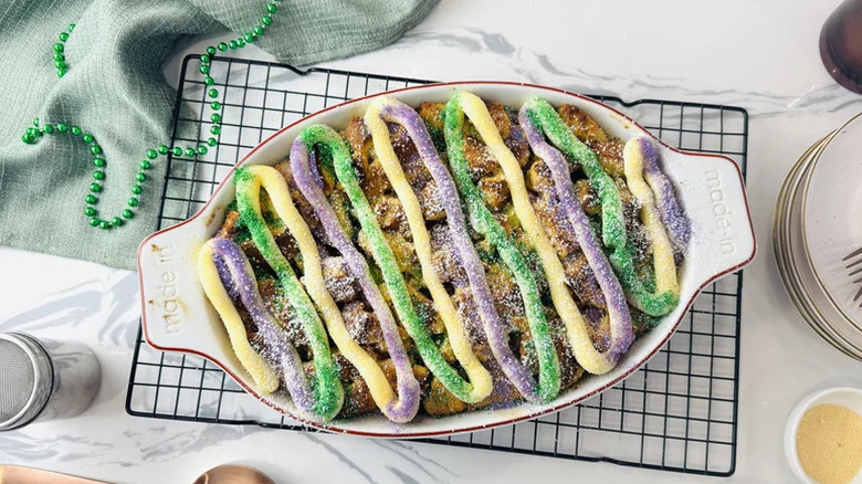 Mardi Gras King Cake-Inspired Bread Pudding in oval baking dish