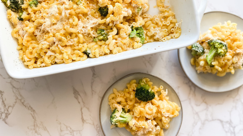 Broccoli mac and cheese served from baking dish onto plates