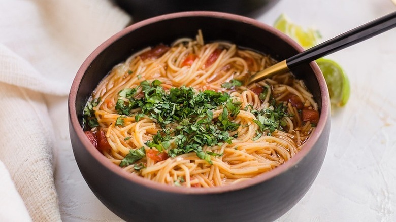 Bowl of fideo soup topped with cilantro
