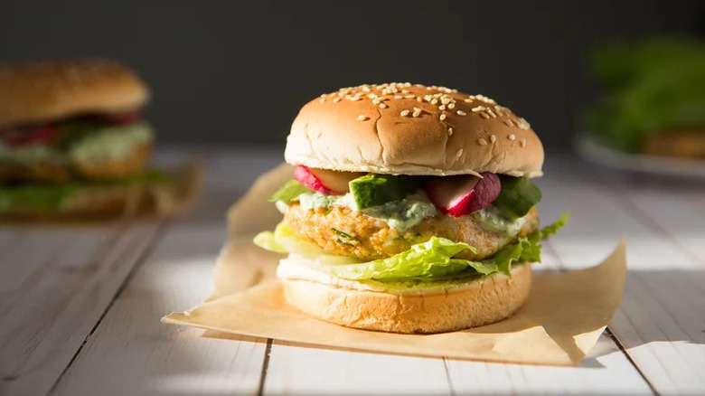 Cilantro-Lime Tilapia Burger on parchment paper in the sun