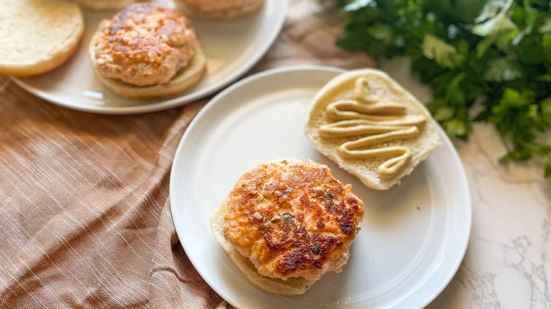Fresh Salmon Burgers on white plates