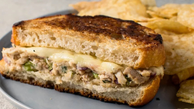 Simple Tuna Melt with chips on grey plate