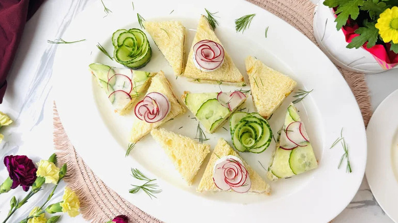 Springtime Smoked Salmon Tea Sandwiches on white plate with garnishes