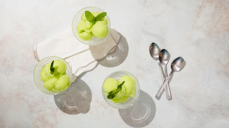 The Princess Diaries-Inspired Mint and Pear Sorbet in glass coupe glasses with spoons