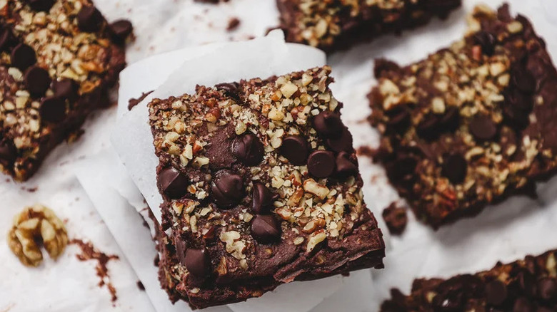 Vegan and Gluten-Free High Protein Chocolate Brownies on white parchment paper