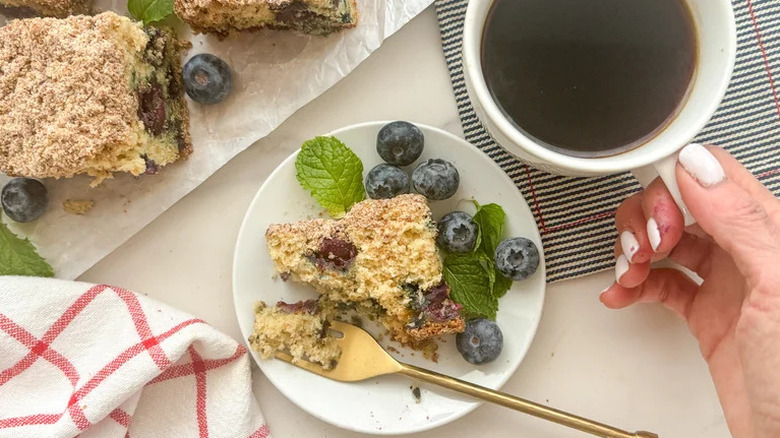 Vegan Blueberry Coffee Cake on white plate with whole berries