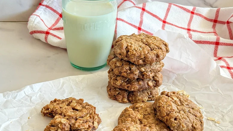 Stack of Vegan Chewy Oatmeal Cookies on crinkled white parchment paper