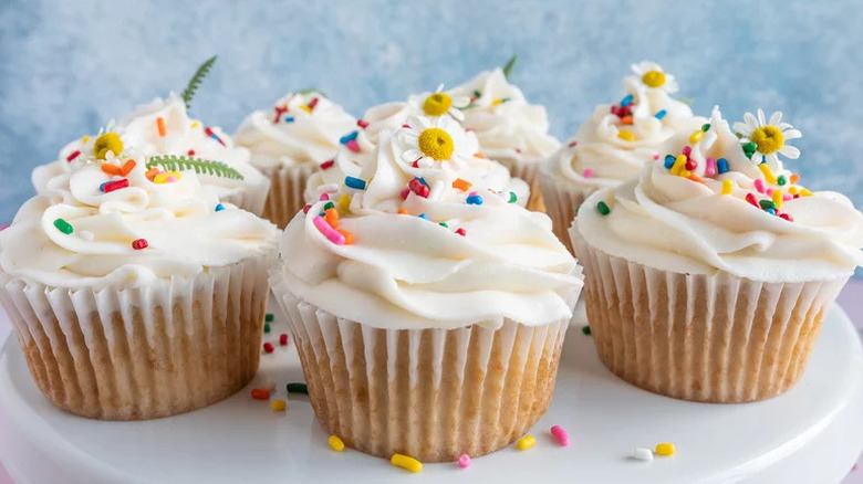 Vegan Vanilla Cupcakes with sprinkles on white plate