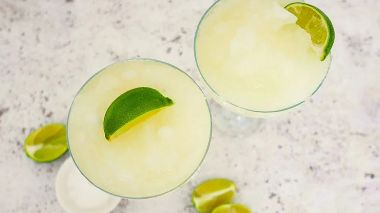 Classic Frozen Margarita Cocktails in two glasses from above