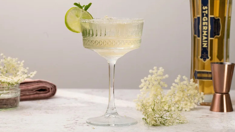 Elderflower Margarita Cocktail in decorative coupe glass with lime slice