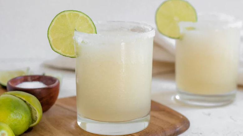 Frozen Margarita Cocktail in glass with slice of lime garnish