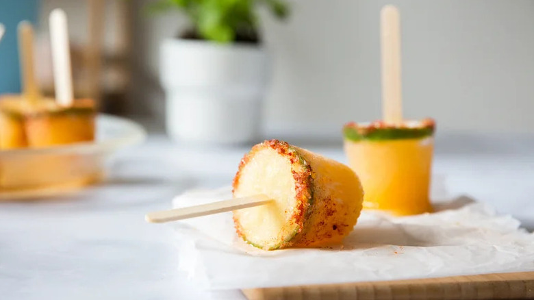Frozen Margarita Popsicles on parchment paper