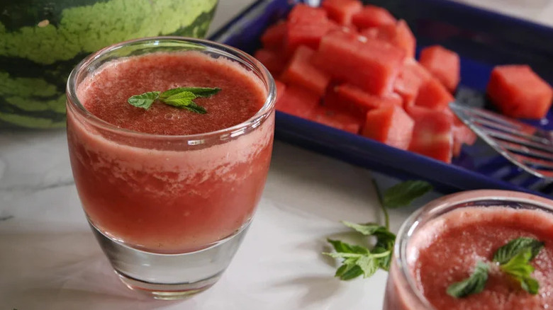 Frozen Watermelon-Ginger Margarita in glass with watermelon in background