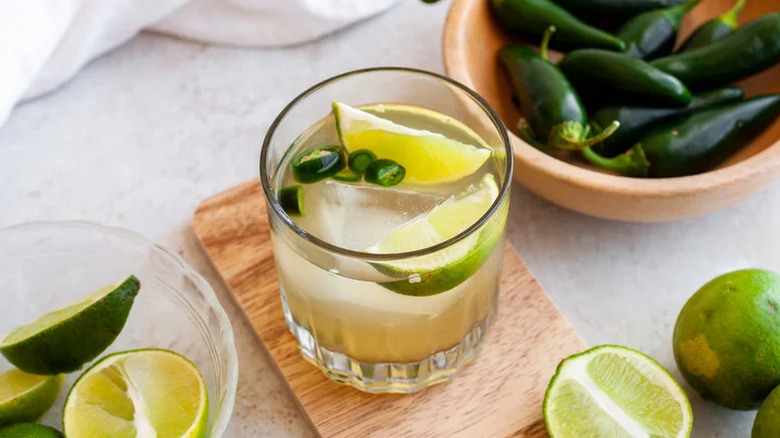 Refreshing Spicy Margarita in glass on wooden table
