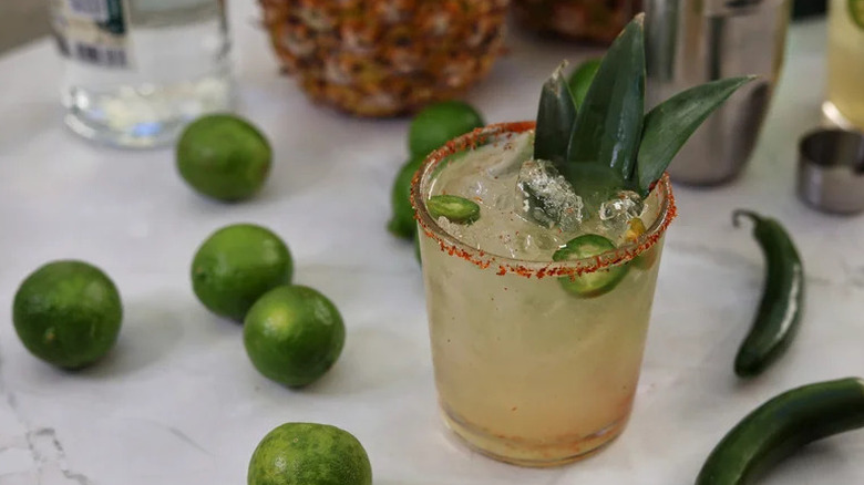 Spicy Pineapple Shrub Margarita in tumbler with spicy rim