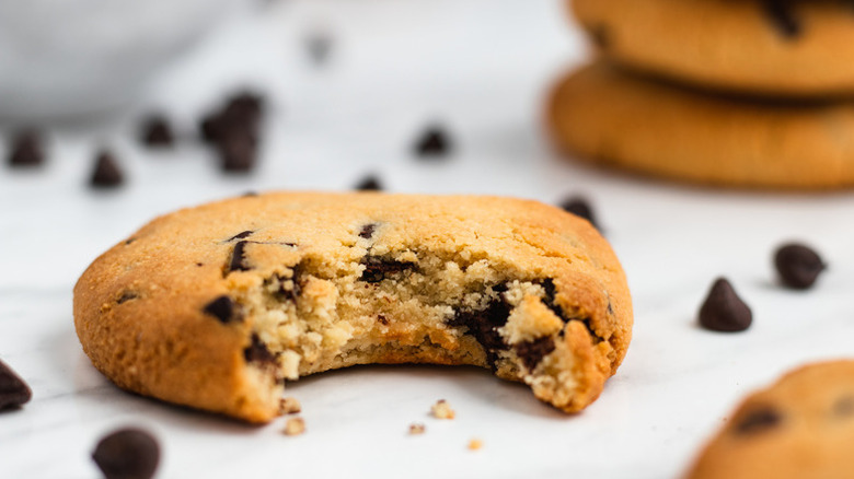 Almond flour chocolate chip cookie with bite taken out of it