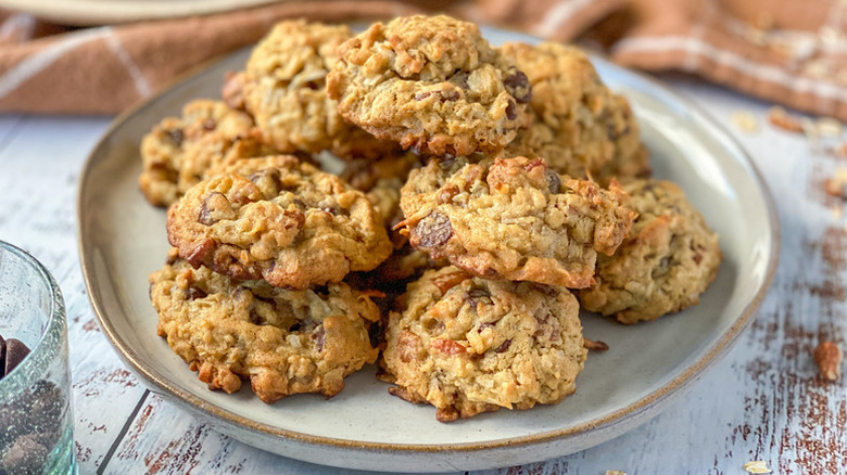Pile of chocolate chip cowboy cookies on plate