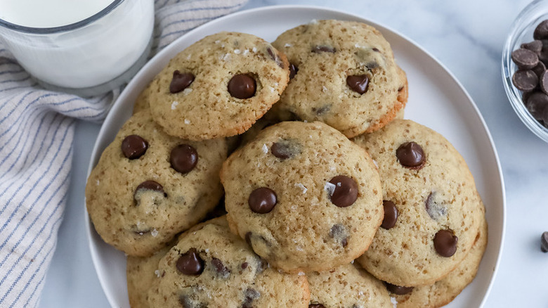 Pile of quinoa chocolate chip cookies on white plate