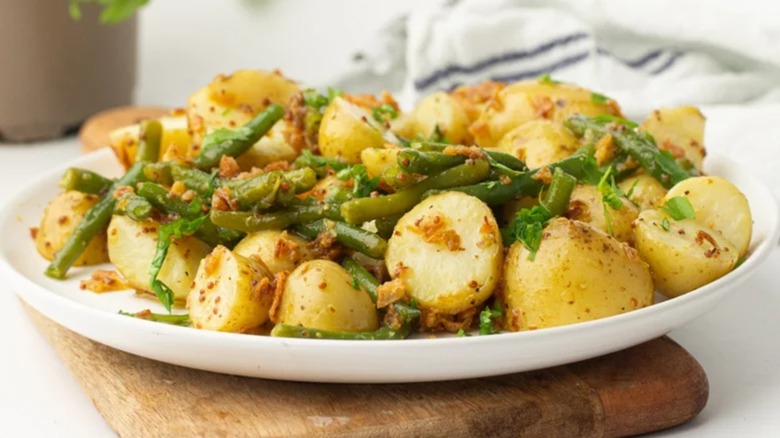 Plate piled high with green bean potato salad