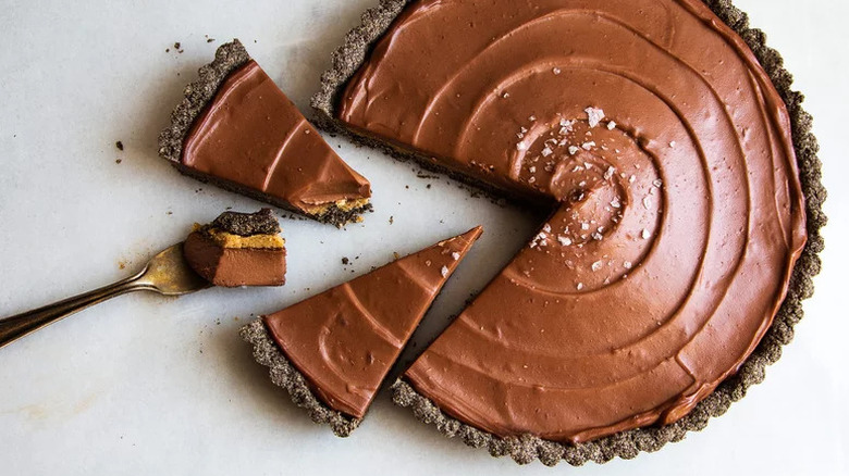 Chocolate Hazelnut Tart with slices cut out