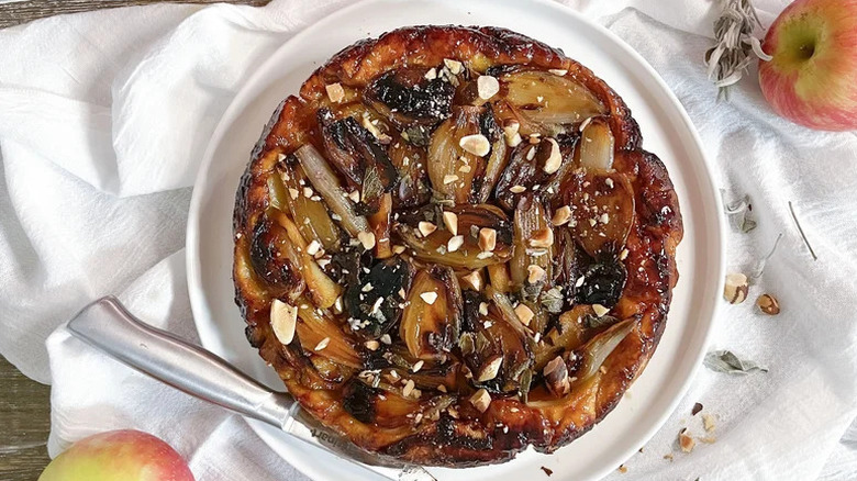 Crispy, Caramelly Shallot and Apple Tart Tatin on white plate