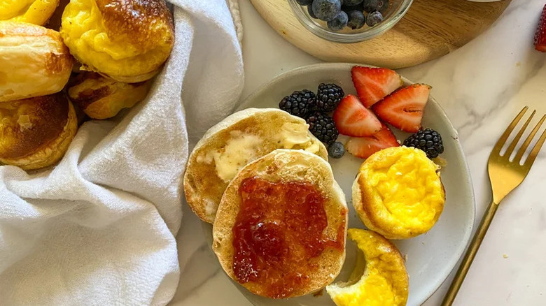 Hong Kong-Style Egg Tart on white plate with biscuits and berries