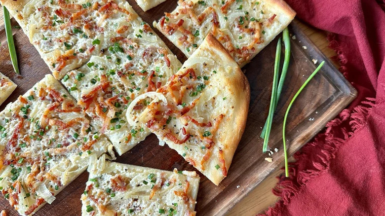 Tart Flambée (French Bacon and Onion Tart) on wooden board