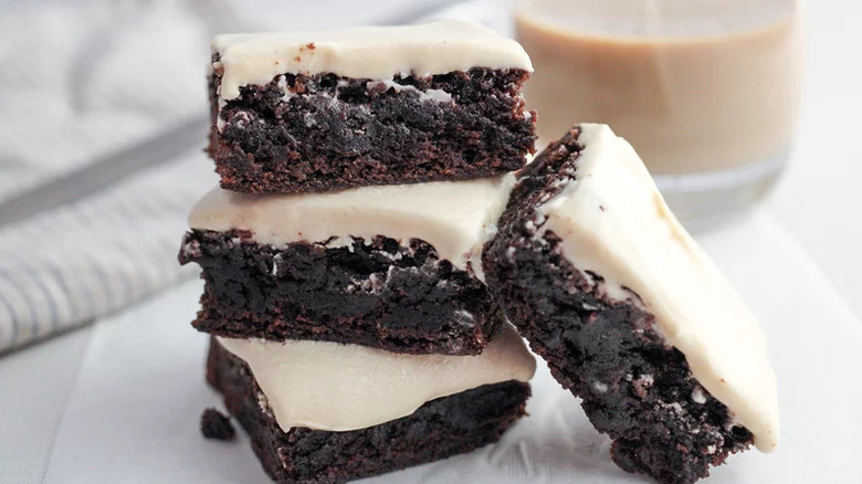Frosted Irish Cream Brownies stacked on top of one another