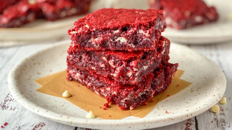 Red Velvet Brownies stacked on beige plate