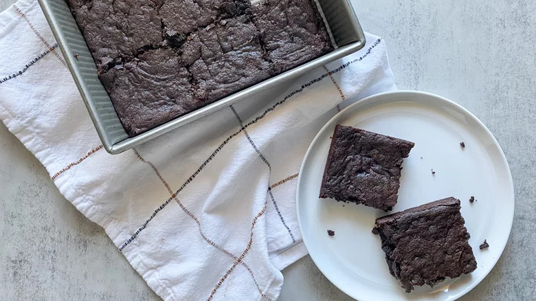 Sweet Potato Brownies on white plate on towel